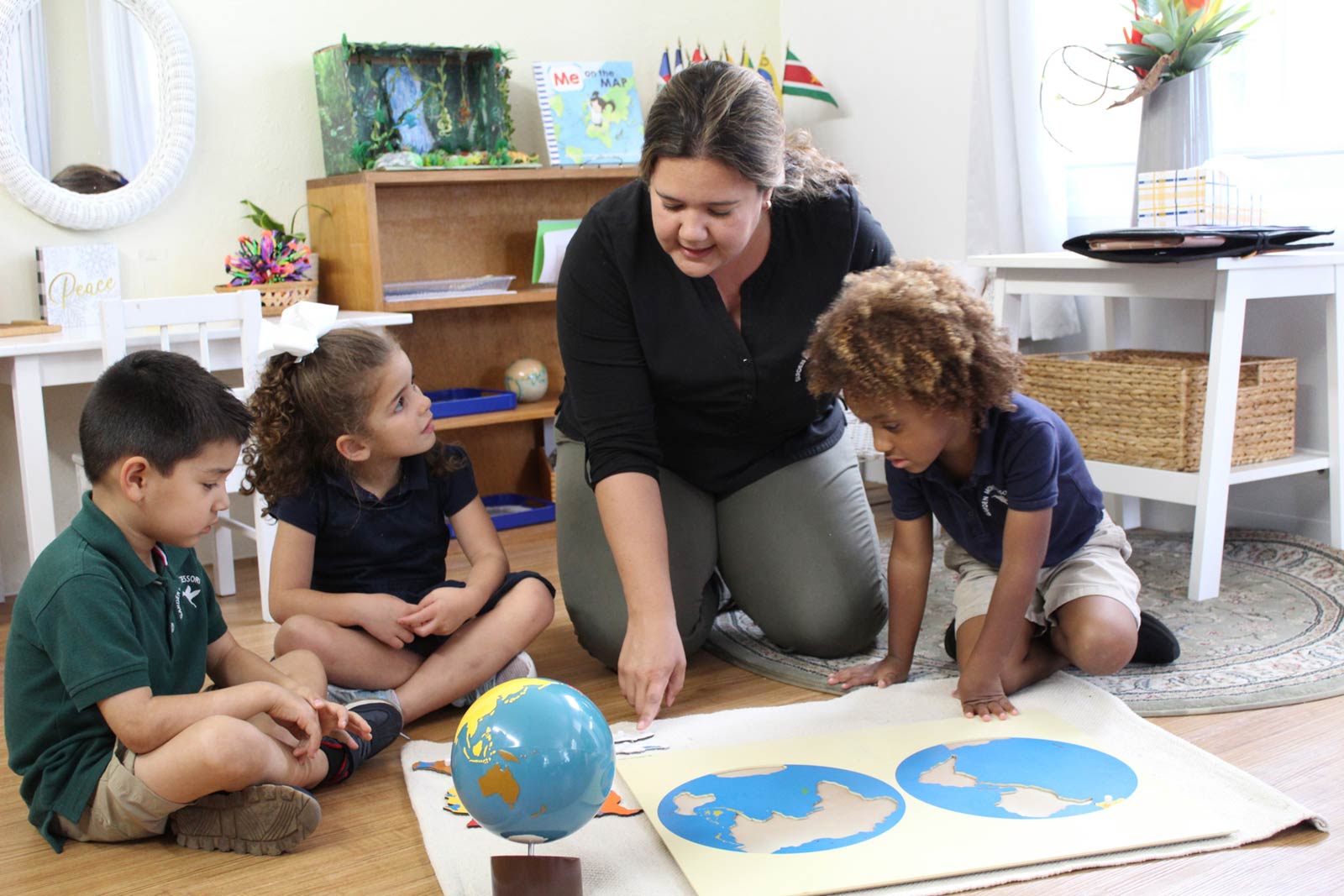 Montessori students with a teacher